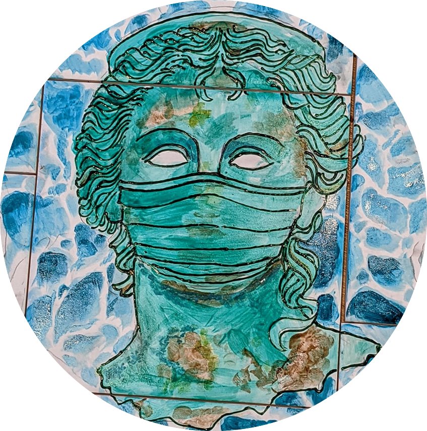 Image ID: Painting on ceramic by Dara Condon as part of the Strangely Disjointed & Idiosyncratic exhibition. The painting is of a goddess in the style of an Ancient Greek bust. The goddess is wearing a face covering. The background is done in shades of blue and white. The goddess is mostly blue except for the eyes which are white. The goddess is outlined in black and there are also shades of brown in places around the neck and face.